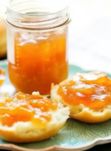Golden apricot pineapple jam in glass jars with fresh apricot halves and pineapple chunks, perfect homemade apricot jam recipe