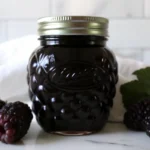 Seedless blackberry jam in glass jars showing smooth purple texture without seeds, homemade traditional recipe
